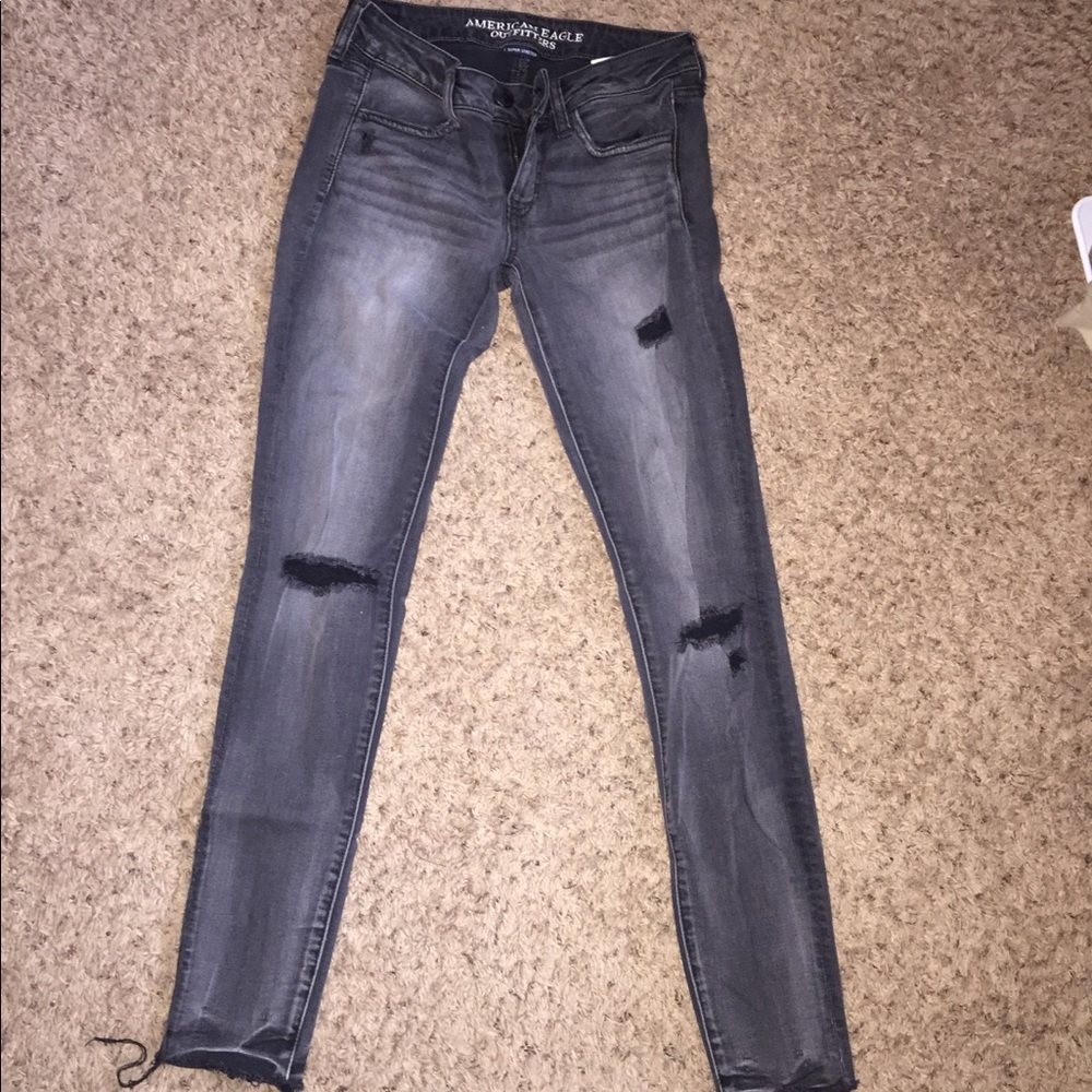 Distressed black jeggings